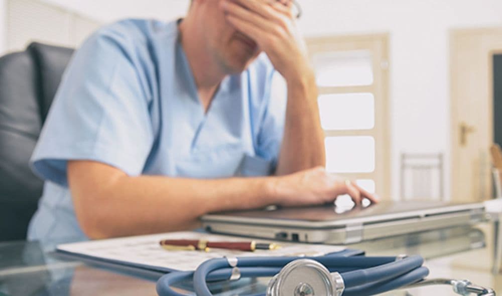 male doctor stressed job